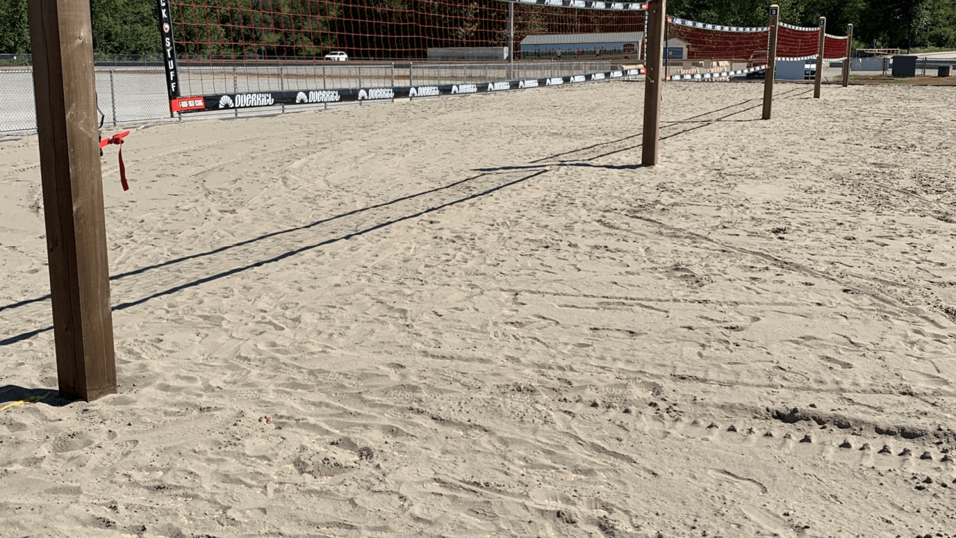 A row of volleyball court on a sandy beach