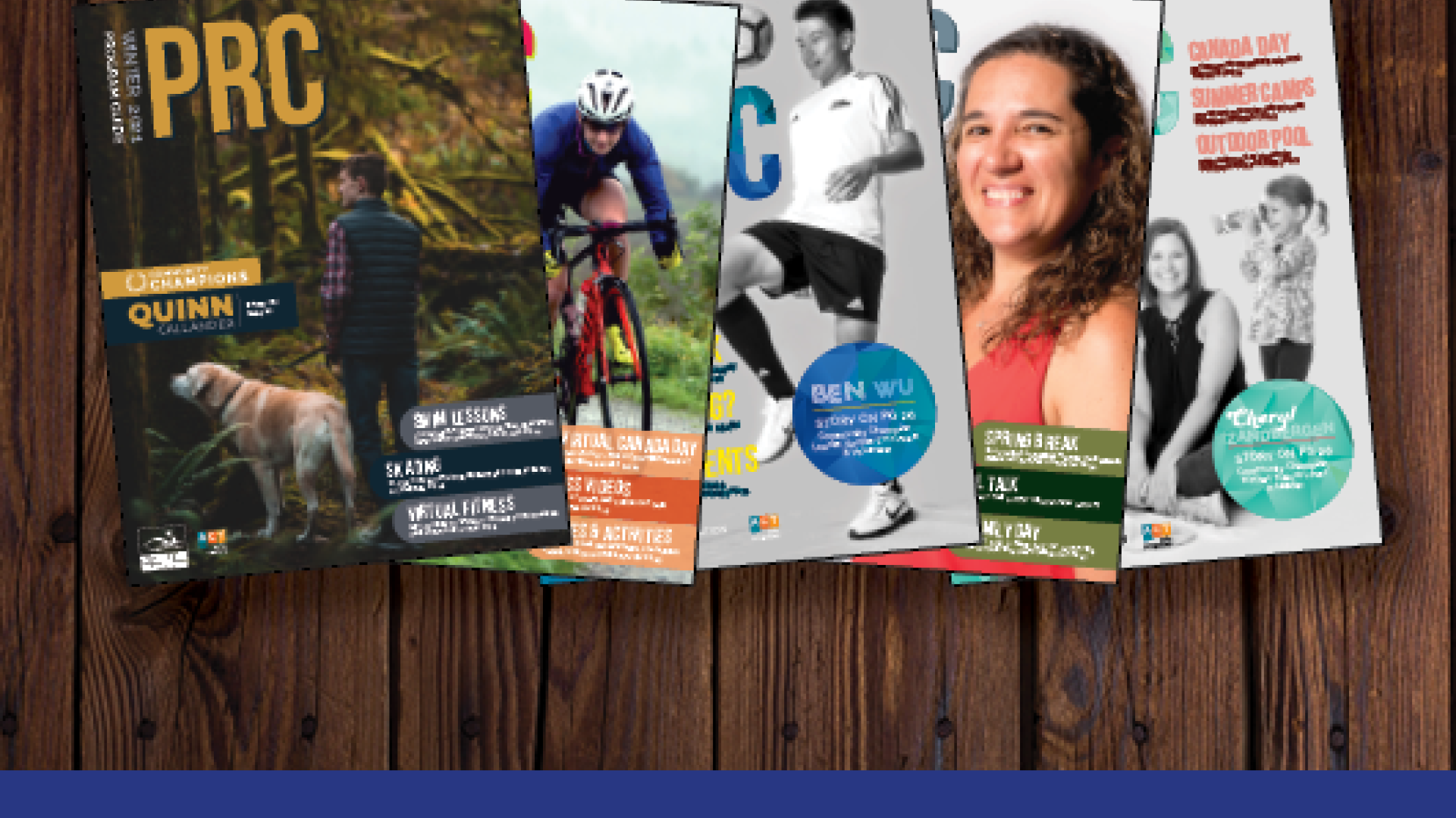 Different magazines laid out on a surface. The surface is wooden and the magazines are fitness-related.