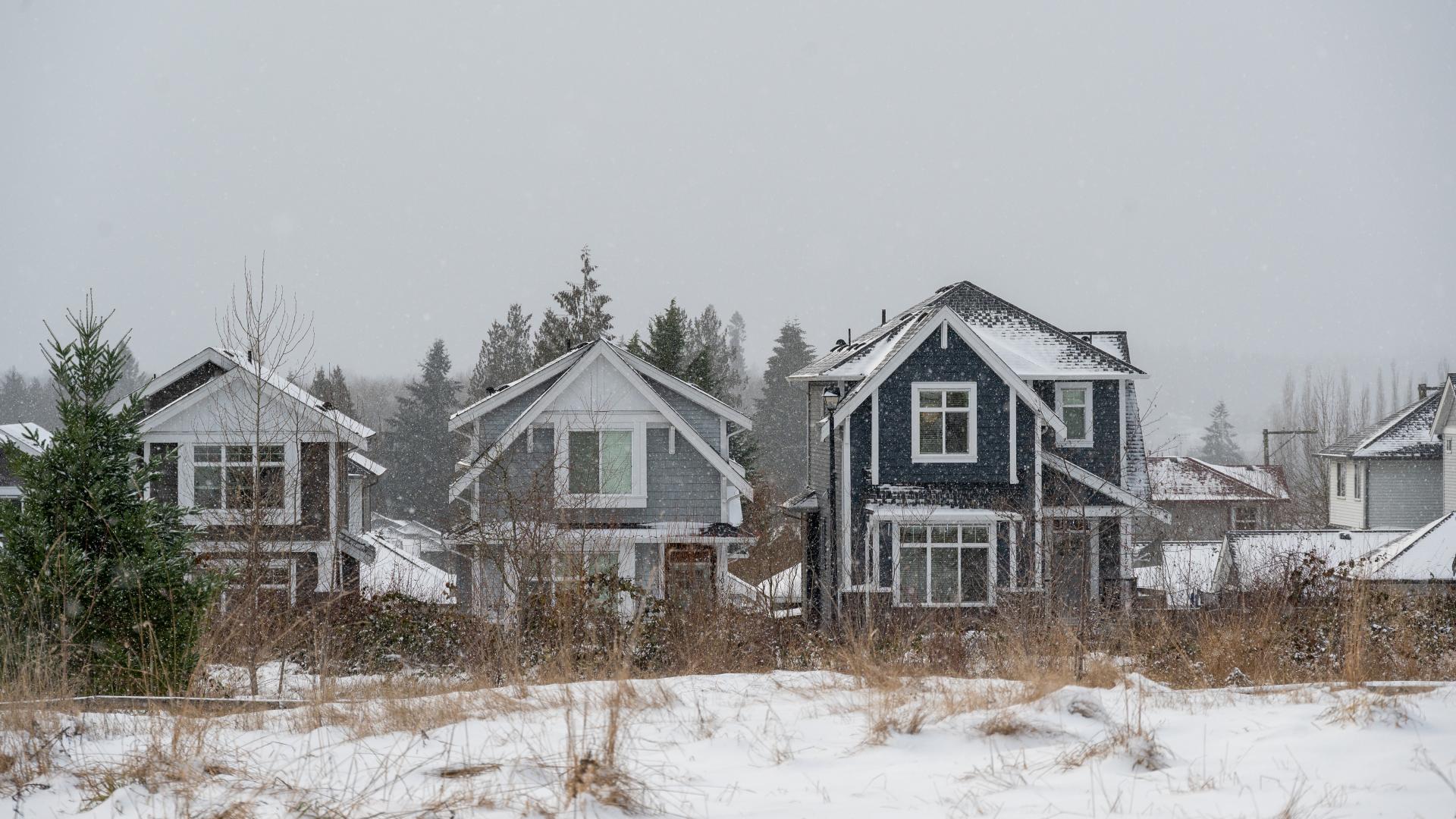 A set of homes covered in snow.