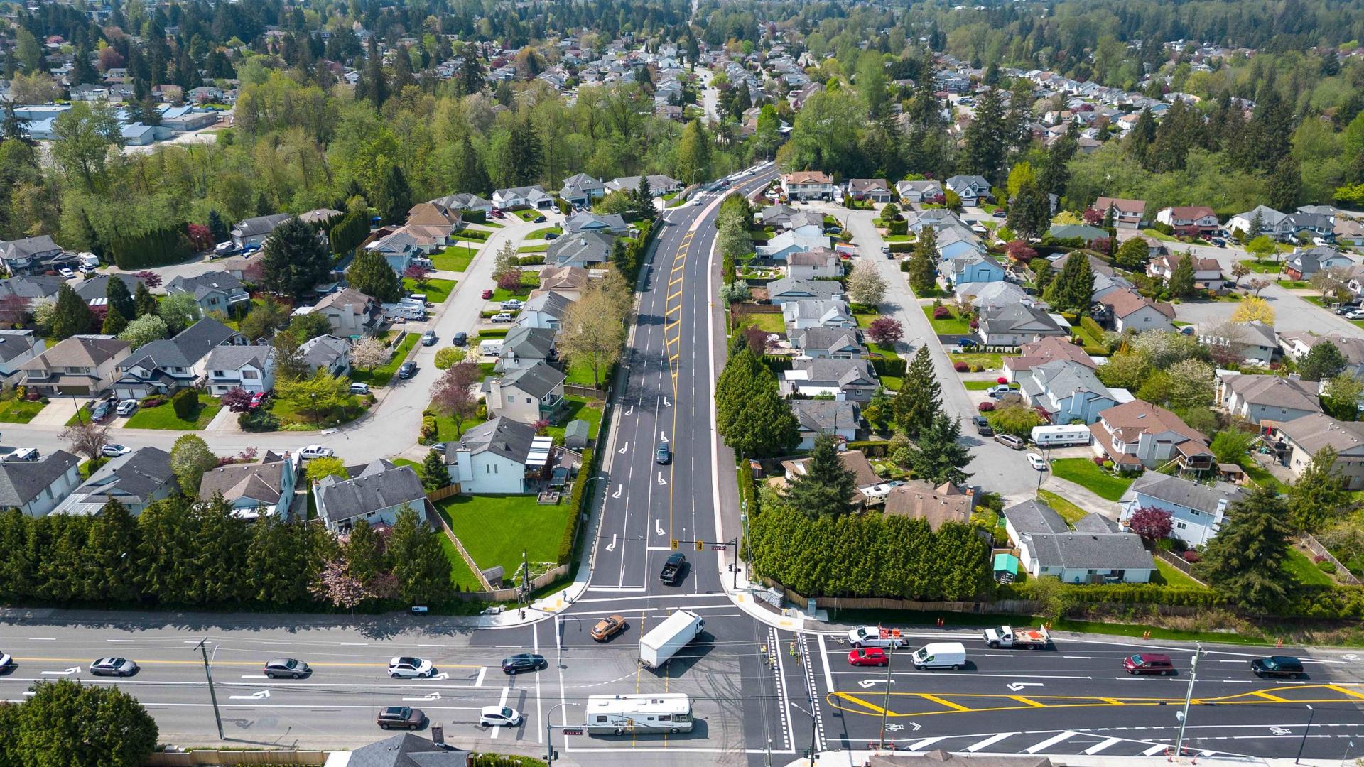 An aerial view of an Abernethy Way intersection with fresh pavement and road lines.
