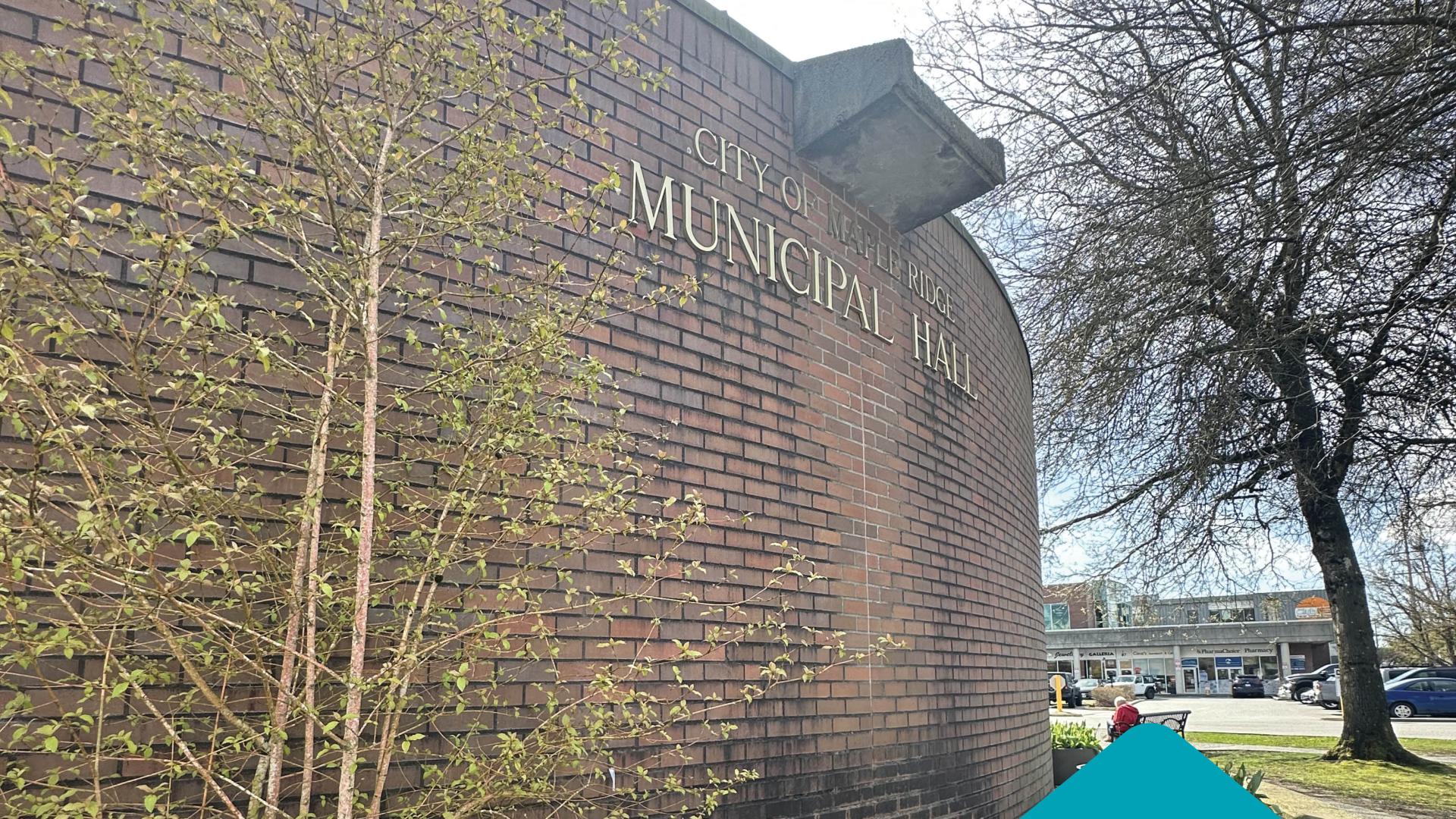 The brick Municipal Hall towers over some small shrubs and greenery with a tree in the background. Below the picture are black text on a blue background proclaiming "Mayor's statement on province bans drug use in public spaces."