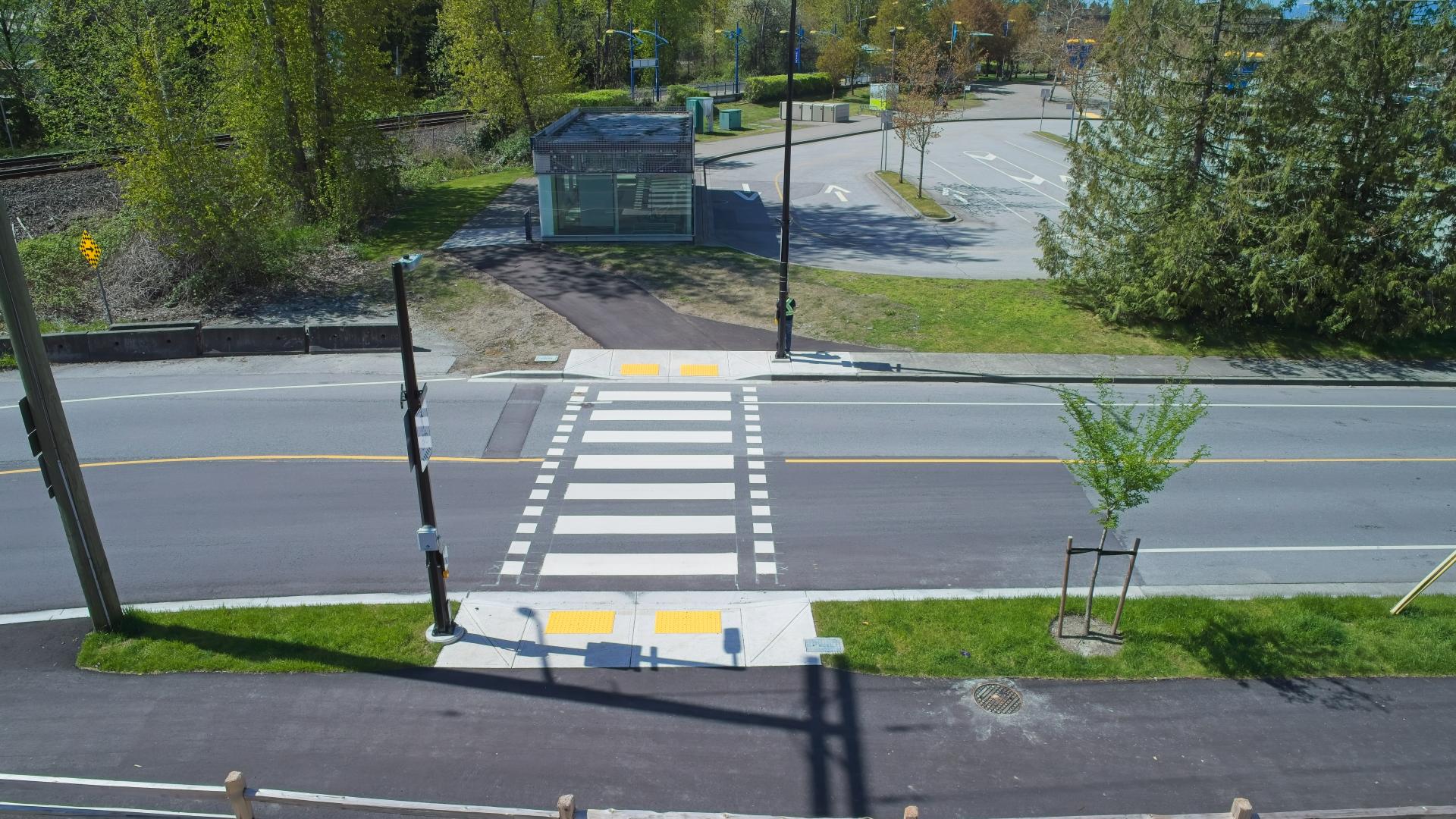The Hammond Multi-Use Path connects to a crosswalk leading to Maple Meadows Station and bus loop.