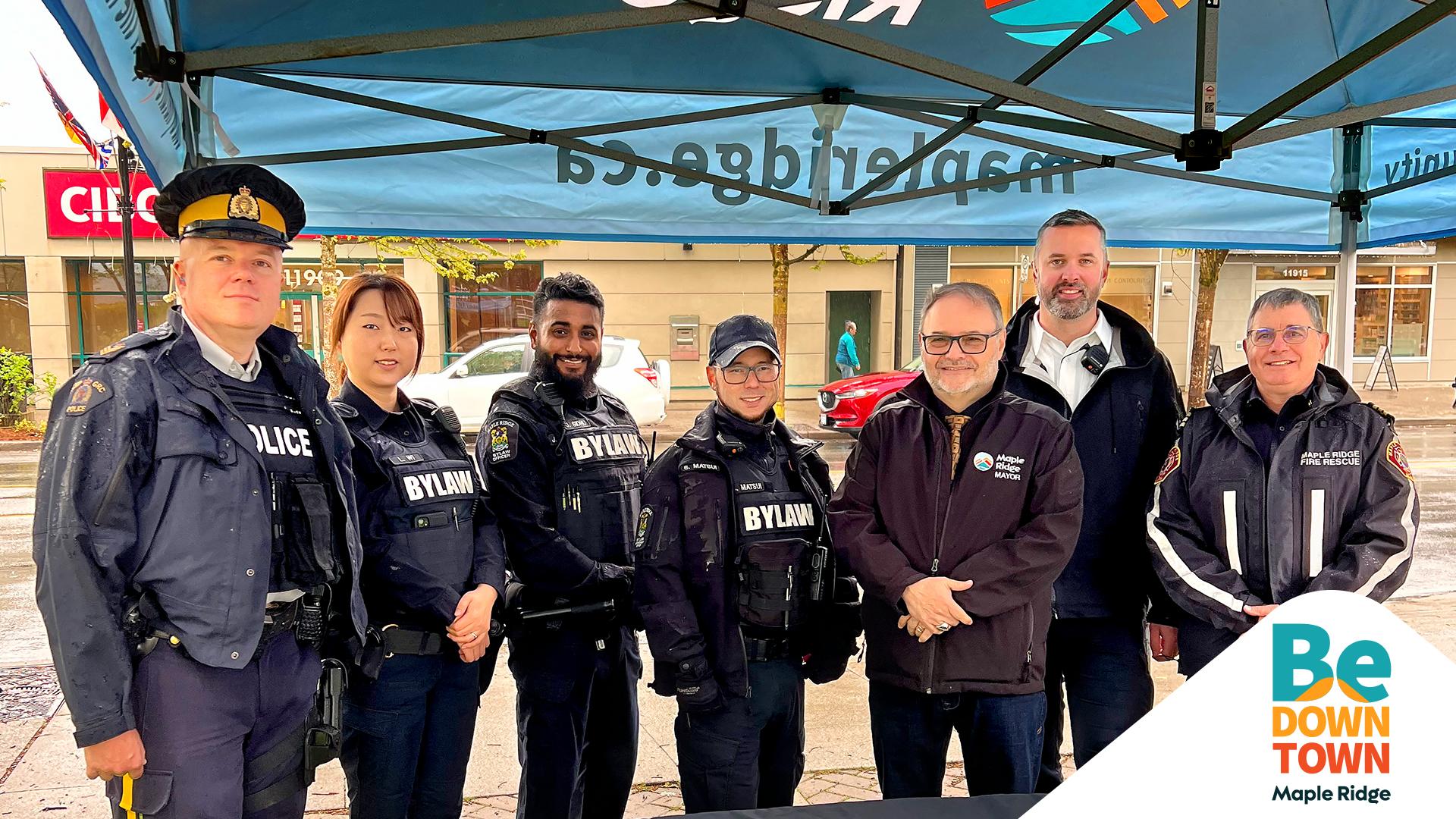 mayor of maple ridge standing with community safety officers