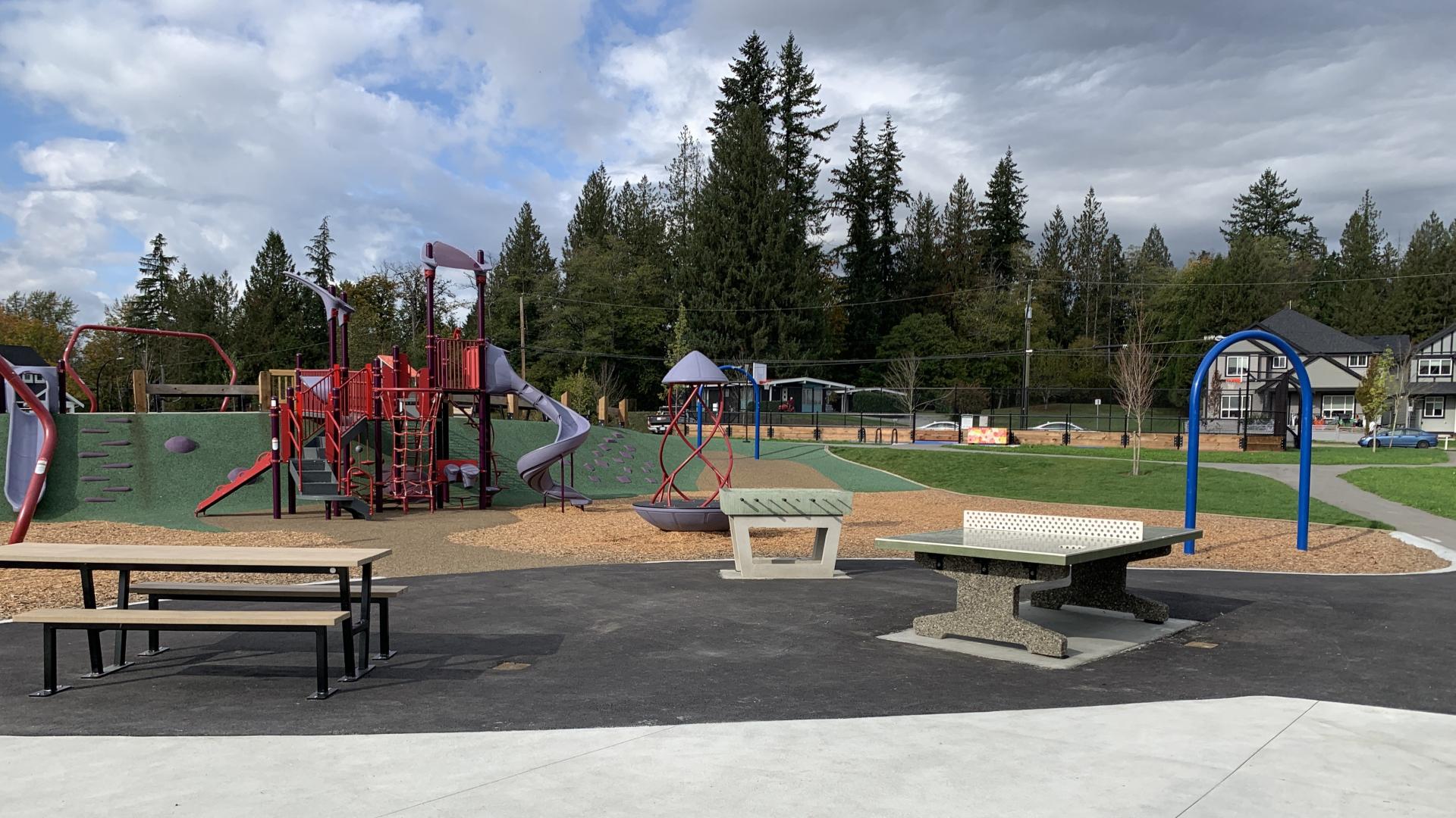 Wide view of tsuyuki park with playground, ping pong table, foosball table and picnic table