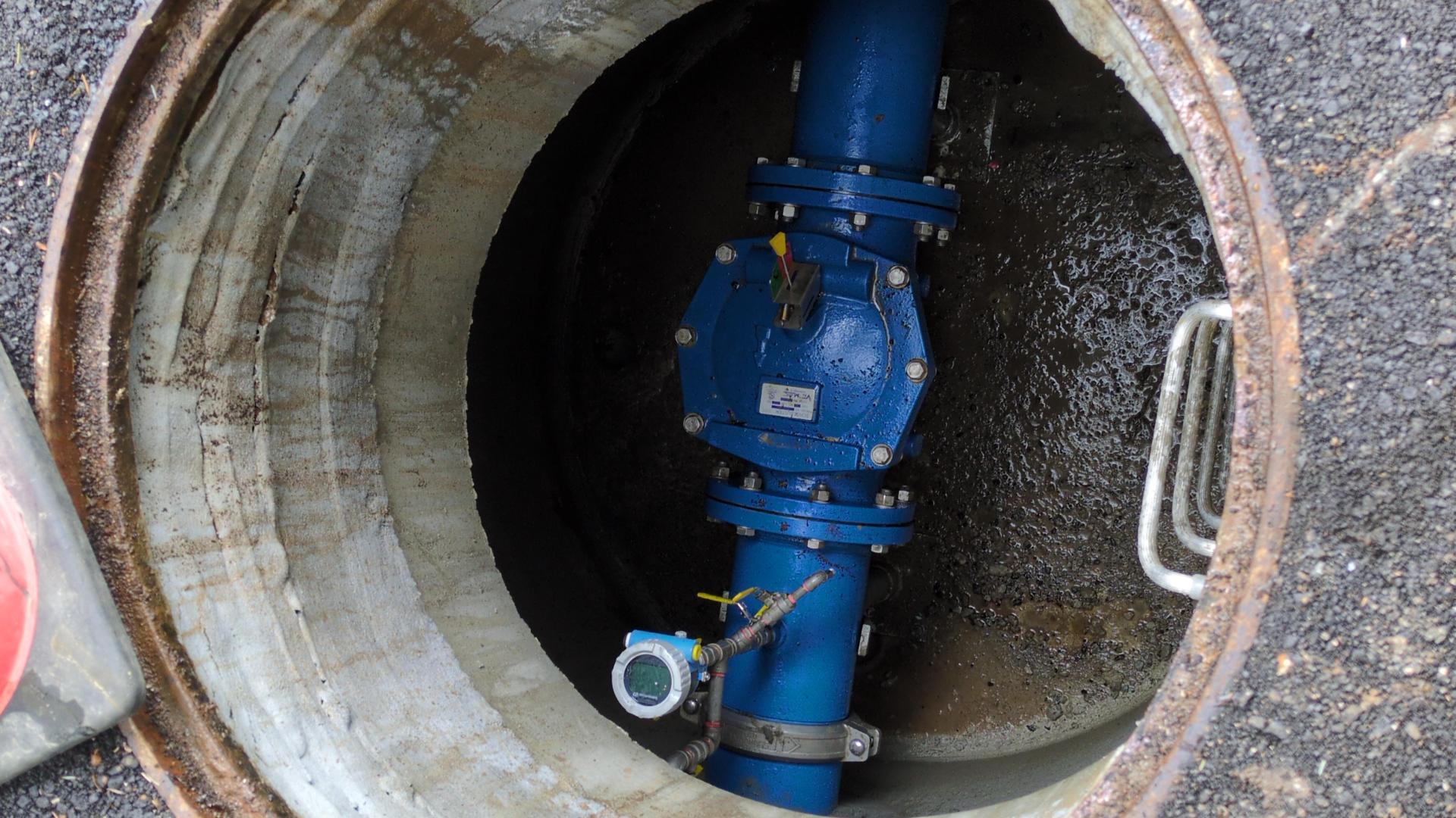 An open manhole showing a water man valve