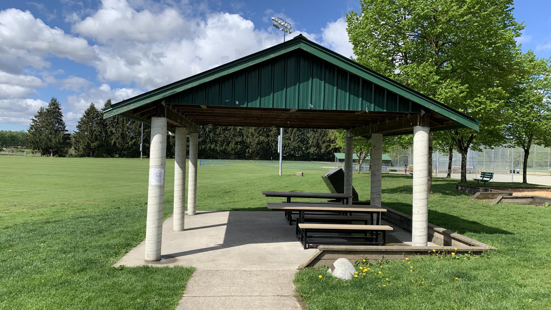 Picnic shelter with two picnic tables