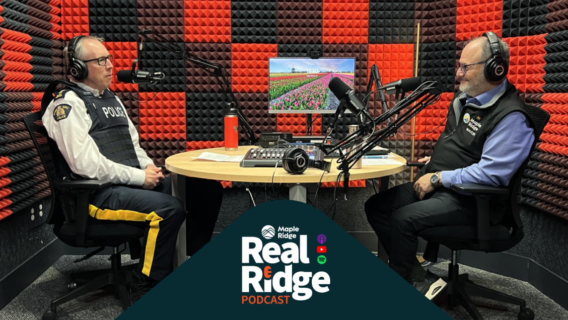 Maple Ridge RCMP Superintendent Adam Gander speaks with Mayor Dan Ruimy in a recording studio.