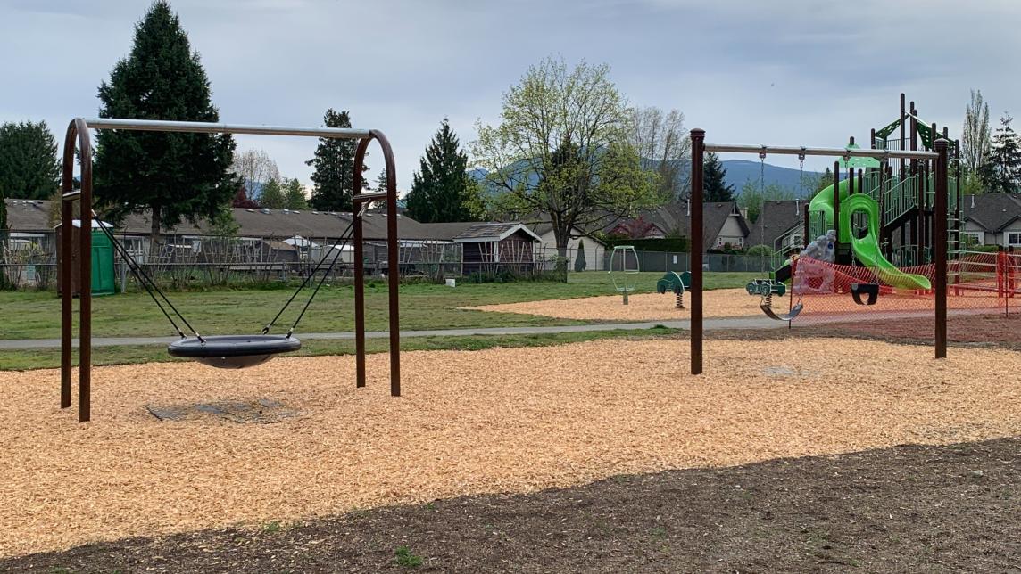 disk swing, belt and bucket swing, playground structure, wood chip paths