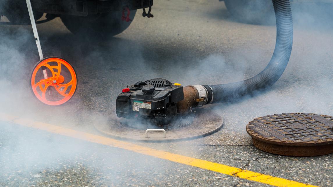 Fog around a maintenance hole during fog testing