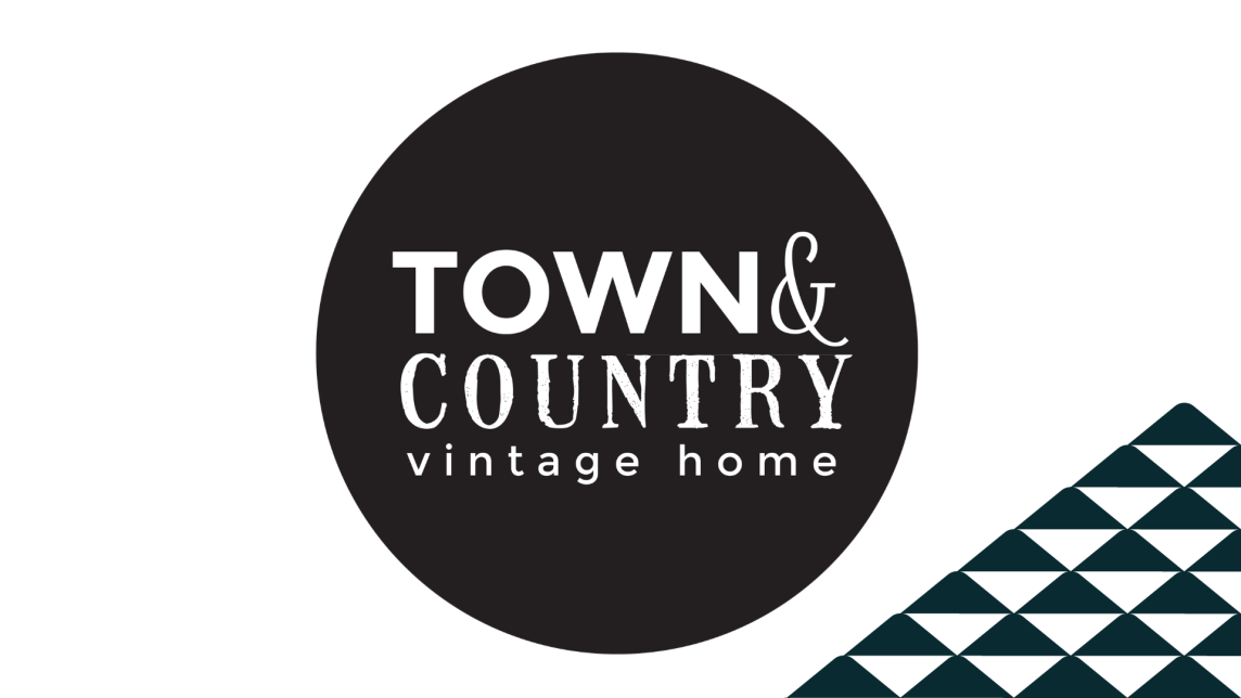 The Town & Country Vintage Home logo next to a soccer-ball patterned mountain.