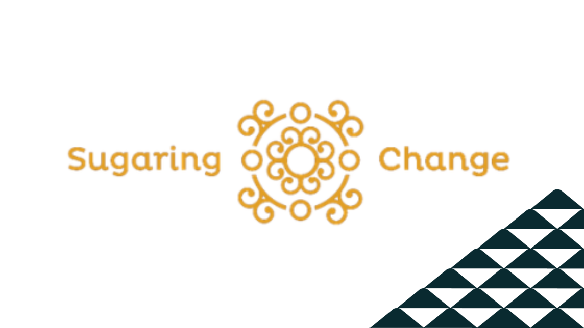 The golden Sugaring Change logo next to a soccer-ball patterned mountain.