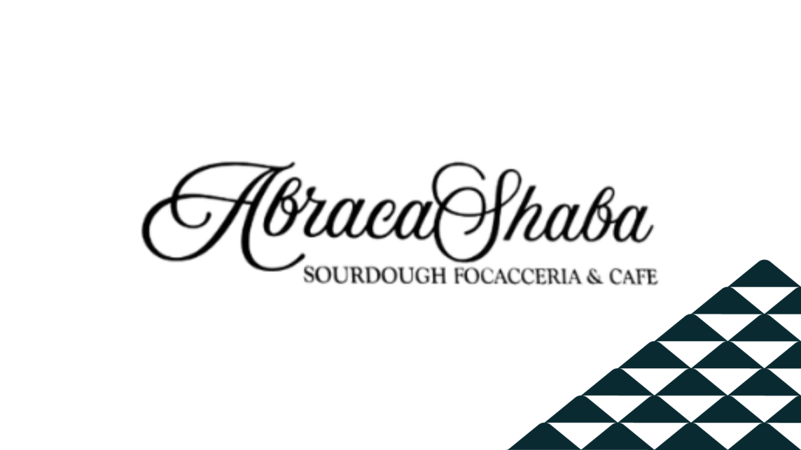 The AbracaShaba logo next to a soccer-ball patterned mountain.