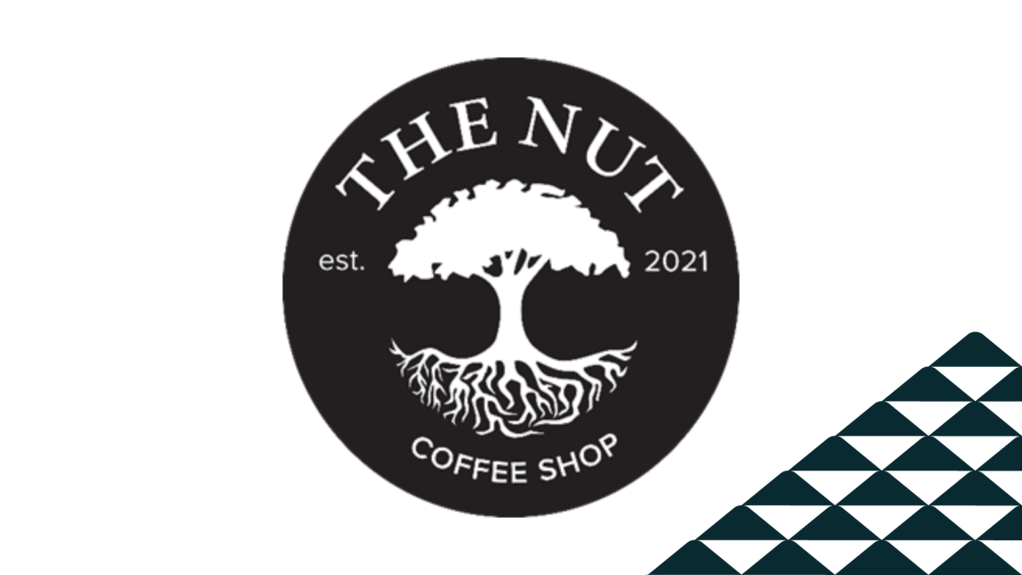 The Nut coffee shop's logo next to a soccer-ball patterned mountain.