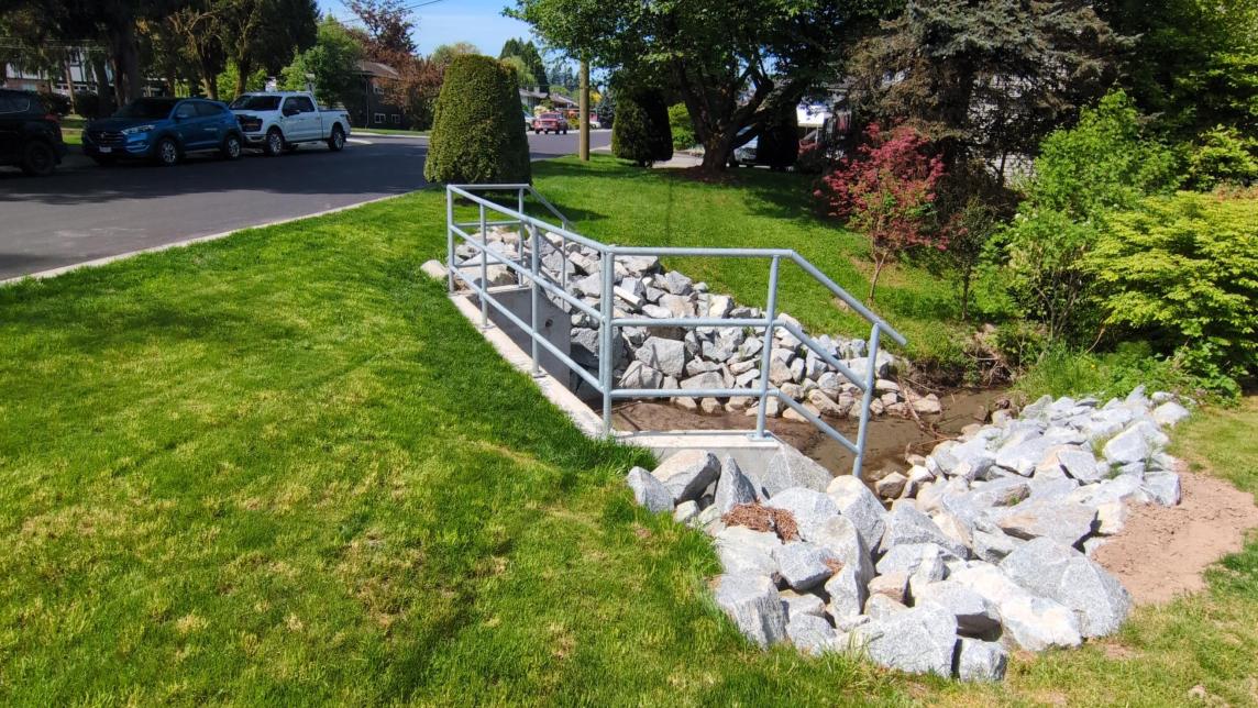 A culvert outlet for the creek that runs under 126 Avenue just east of 217 Street