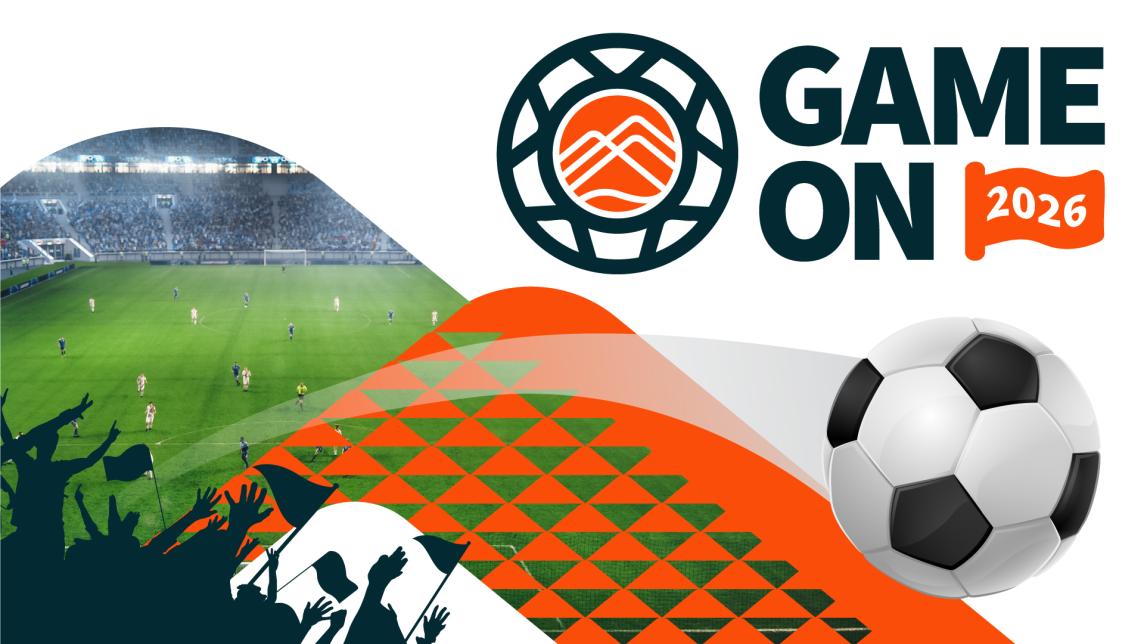Game On 2026. A soccer ball flies off a field and over the heads of the silhouetted crowd.