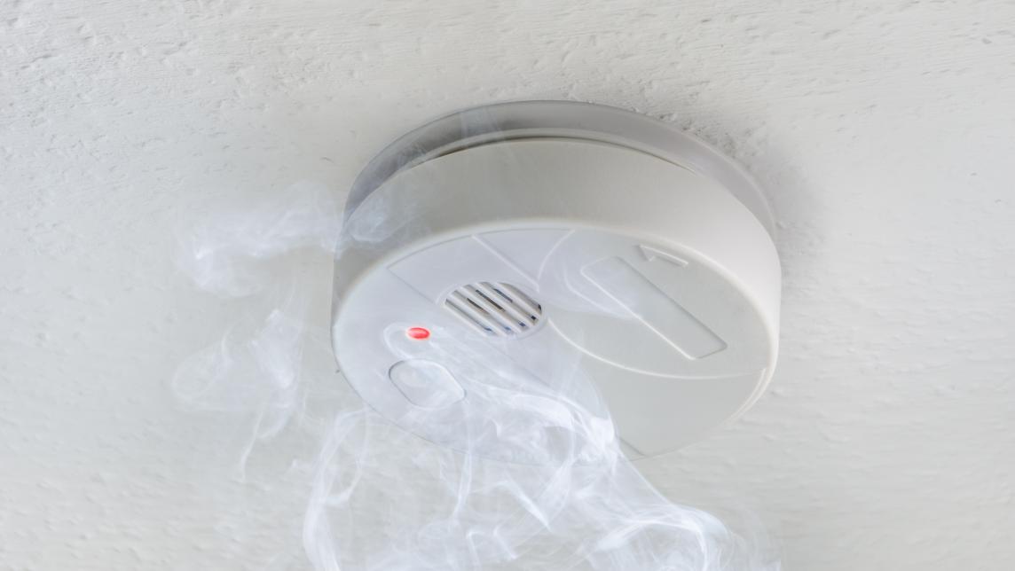 Smoke alarm with plume of smoke