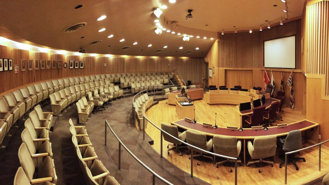 Empty Maple Ridge Council Chambers viewed from the side