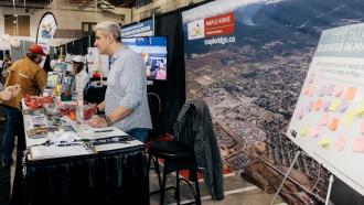 Photo of City staff interacting with someone at the Home Show