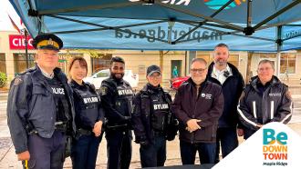 mayor of maple ridge standing with community safety officers