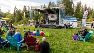 People listening ti the music during community event