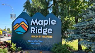A sign stating Maple Ridge, Bold by Nature, welcomes visitors and residents to the city.