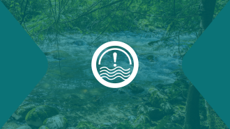 A white icon consisting of an exclamation mark over turbulent waters sits over a faded background showing a rapidly flowing river.