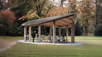 concept design of picnic shelter looking like a large leaf on poles over picnic tables