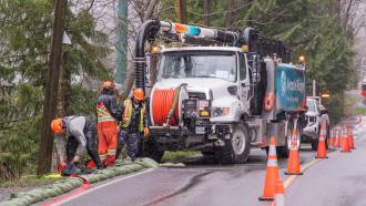 Maple Ridge hydrovac truck with city workers during the March 2026 weather event