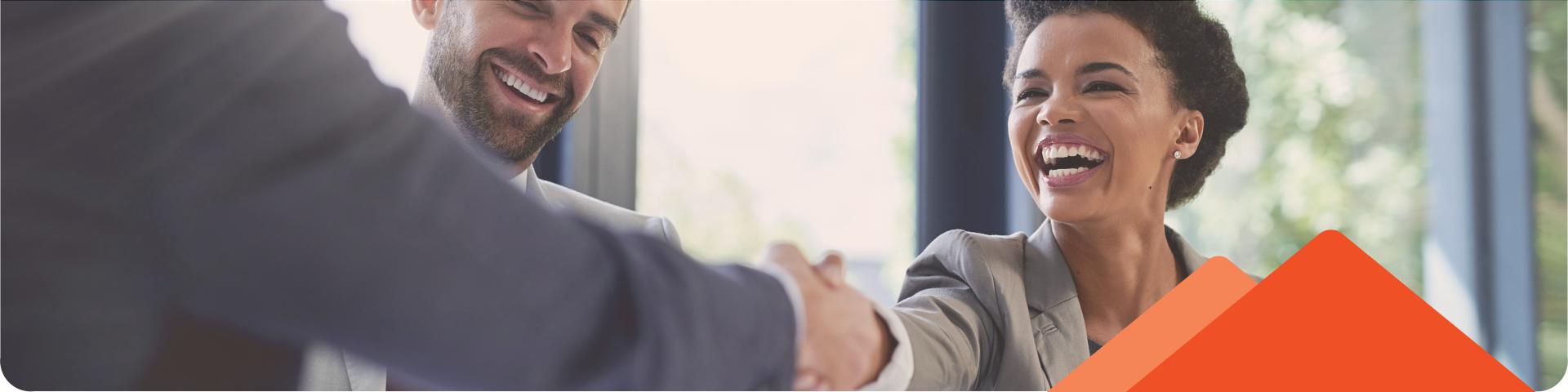 group of people shaking hands smiling