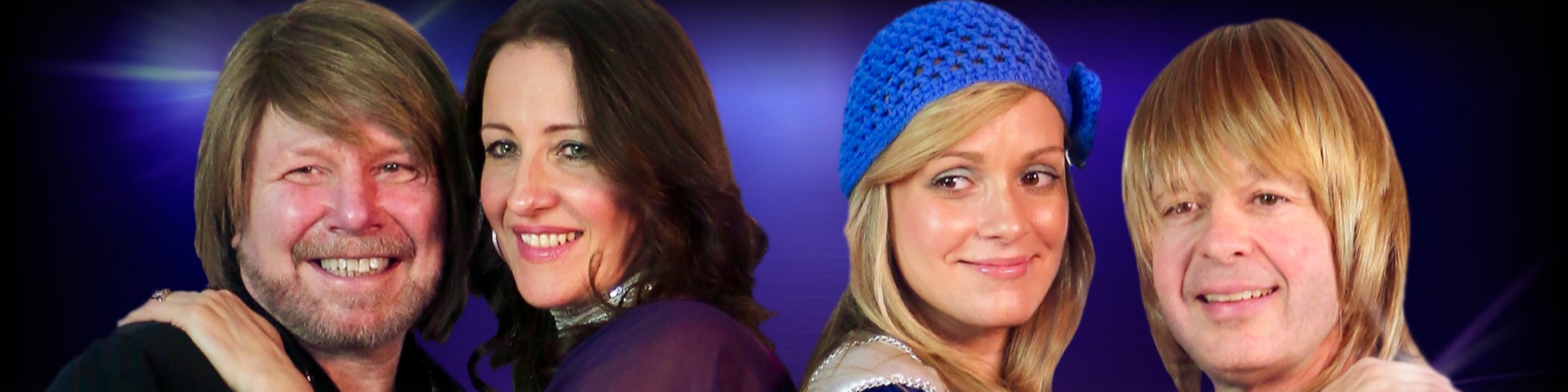 Two sets of couples hold each other against a blue background.