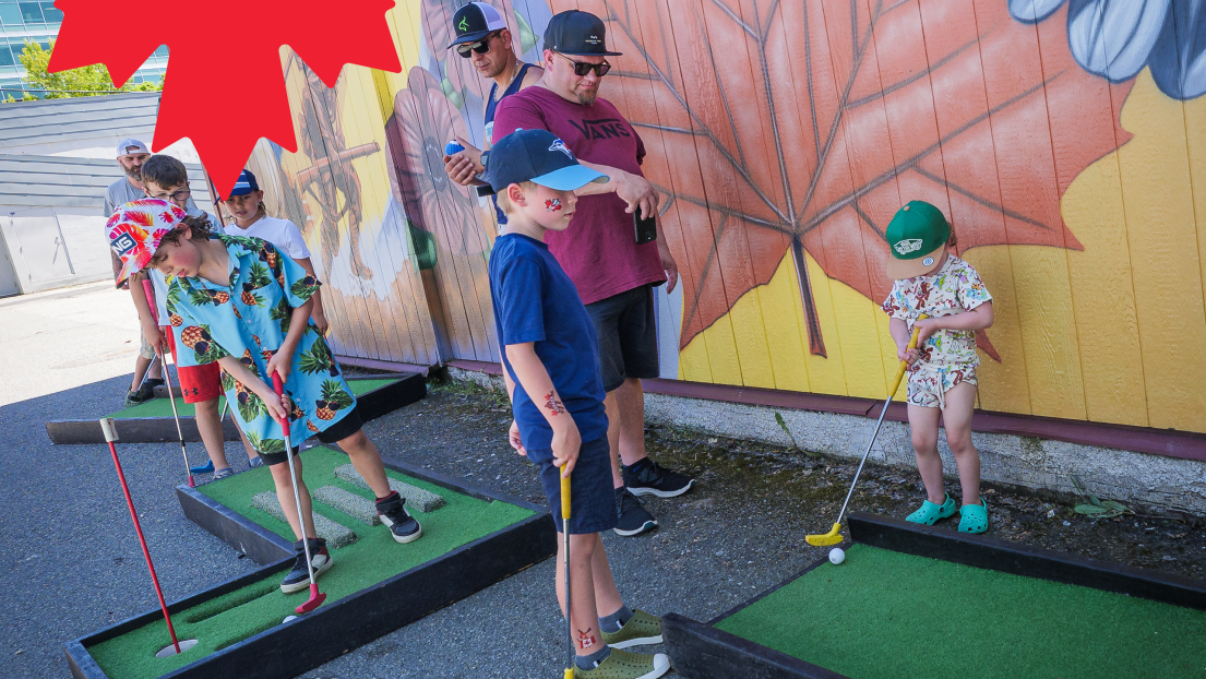 Families Playing Mini Golf