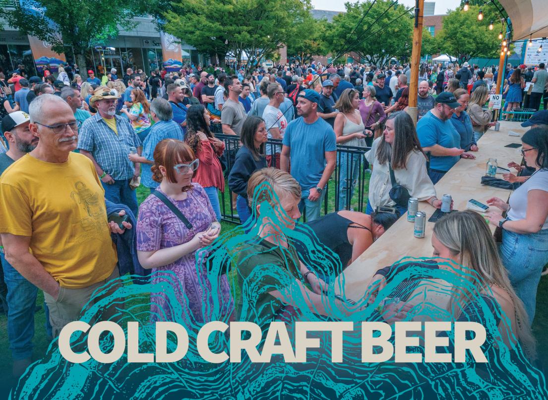 A large crowd waits just outside an event beer stall.