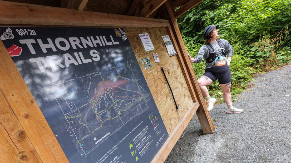 Runner with Thornhill Trails Map