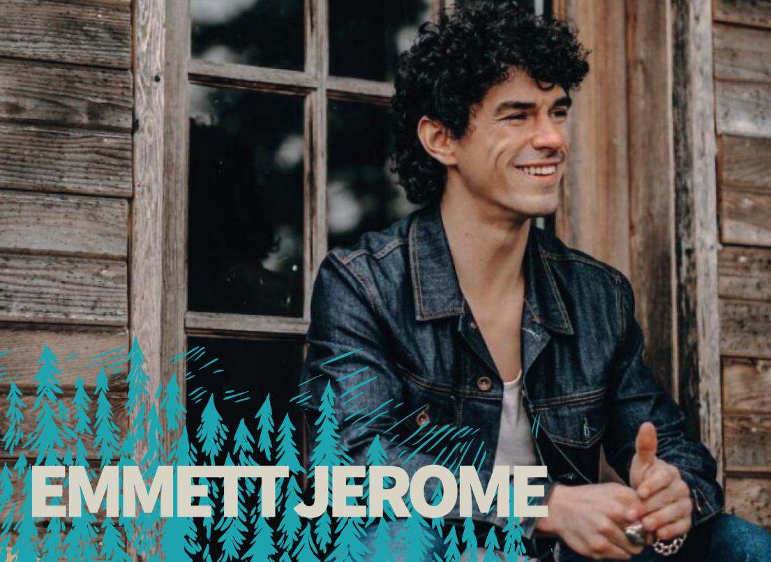 Emmett Jerome sits on the front porch of a rustic wood-plank cabin.