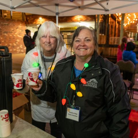 Volunteers at a holiday-themed community event