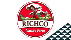 The Richco Nature Farm logo next to a soccer-ball-patterned mountain.