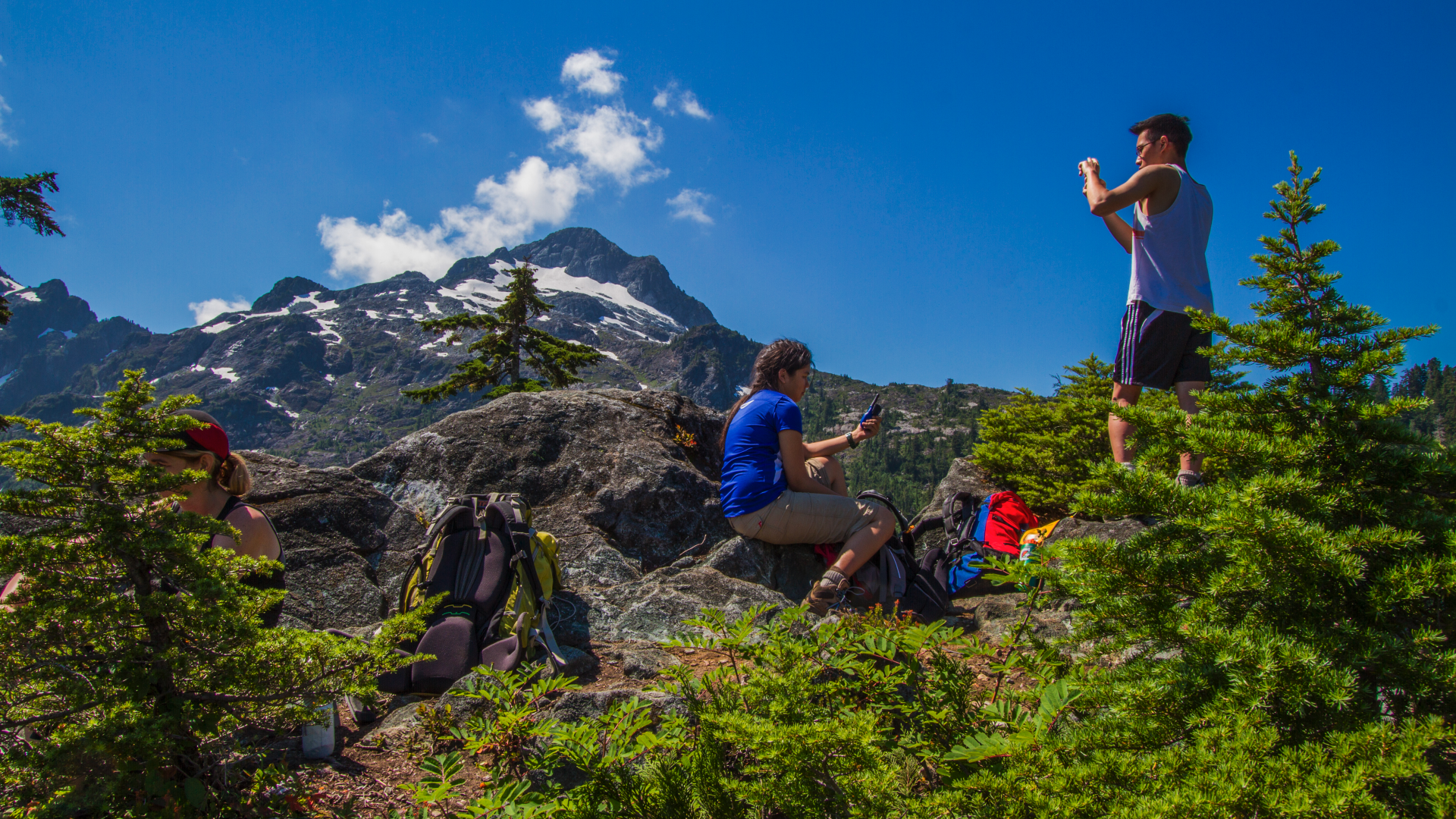 Two people standing on top of a mountain at the Golden Ears Park trail network