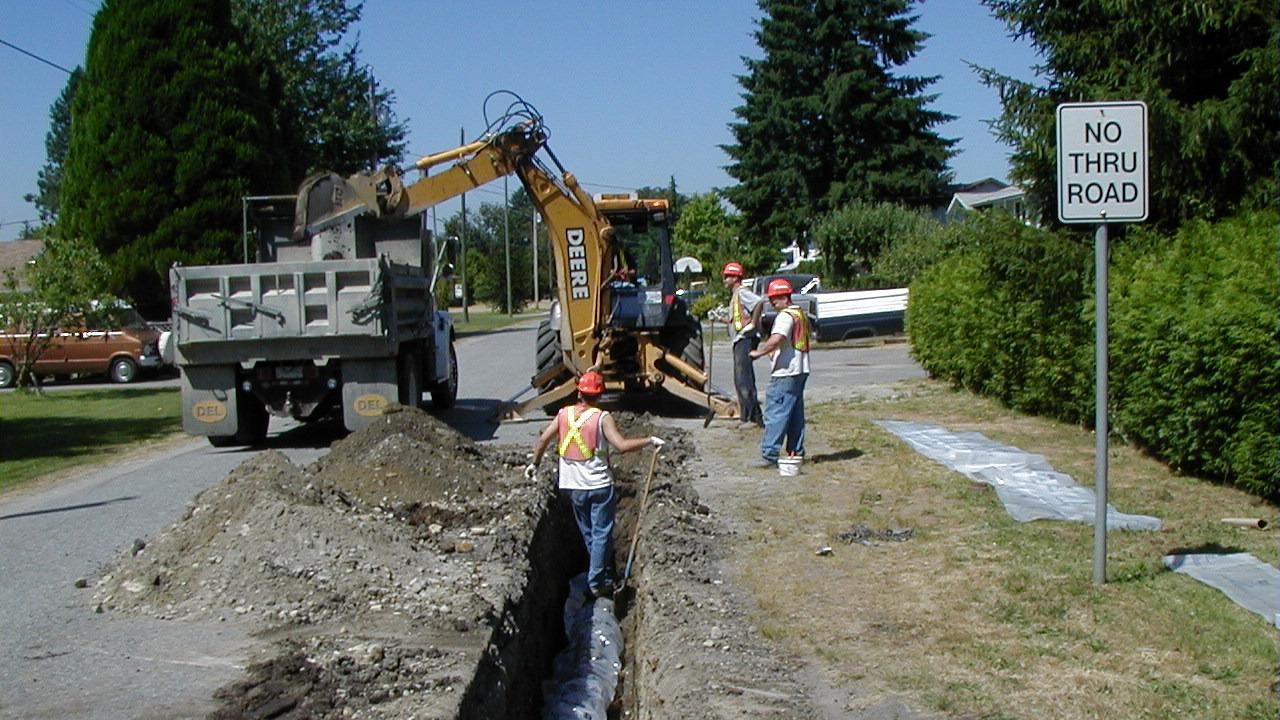 utility workers at a roadside jobsite