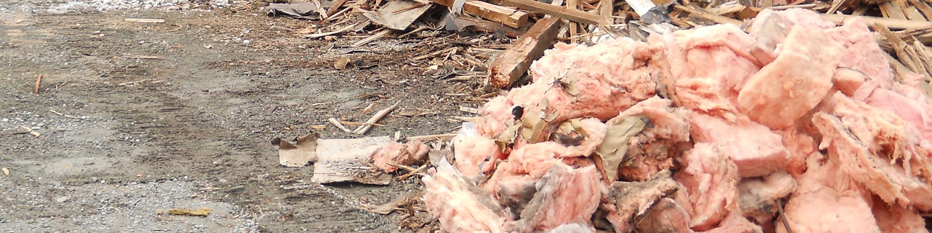 A pile of drywall material at a demolition site waits to be disposed of.