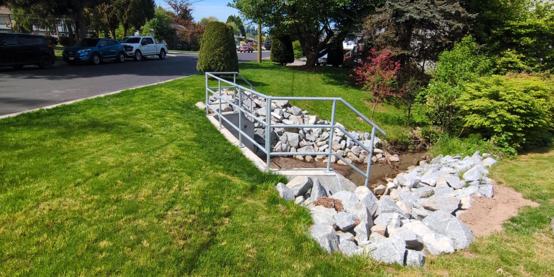 A culvert outlet for the creek that runs under 126 Avenue just east of 217 Street
