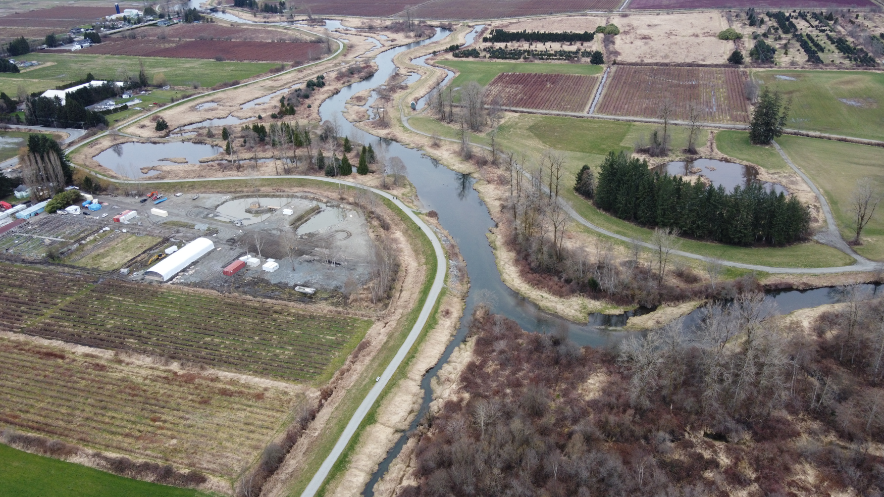 An aerial view of part of McKenney Creek surrounded by farmland